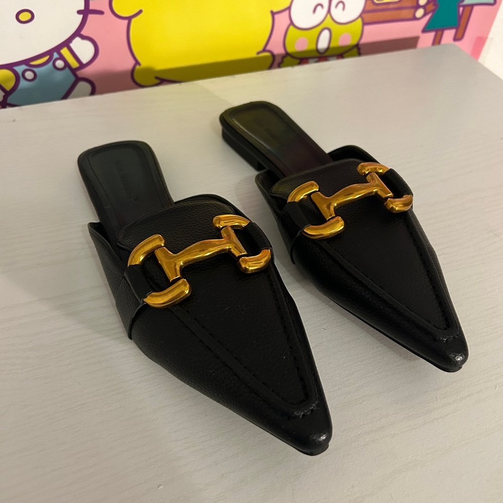 black loafers with gold accent chain